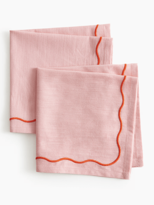 2 Pink Napkins with orange scalloped border design